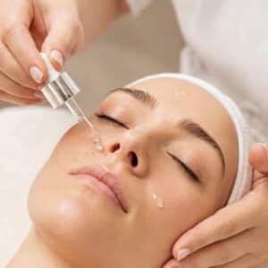 A licensed aesthetician applies a serum during a facial at HS MedSpa in Tysons, VA